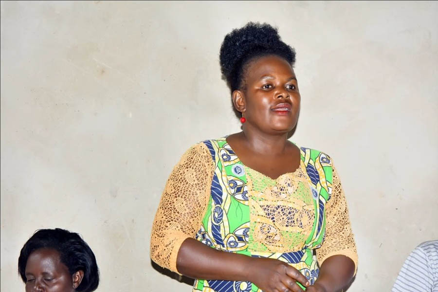 Ms Catherine Nansamba, the Women’s Leader (Nabakyala)of Kiyanja Zone addressing the community meeting.