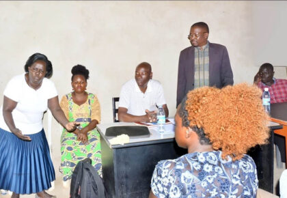 Community meeting organized by Pan African Club scoping the effects of pollution by manufacturing companies on surrounding communities in Kawempe Division